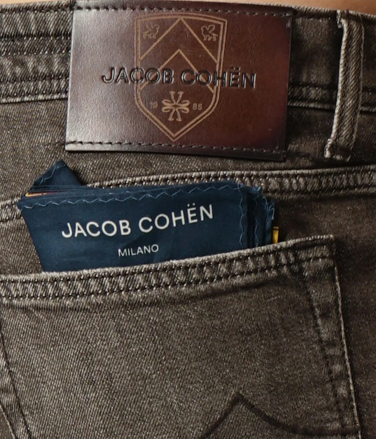 Close-up of Jacob Cohën Bard Regular-Slim Jeans in Dark Brown showing the tobacco brown leather patch and back pocket label