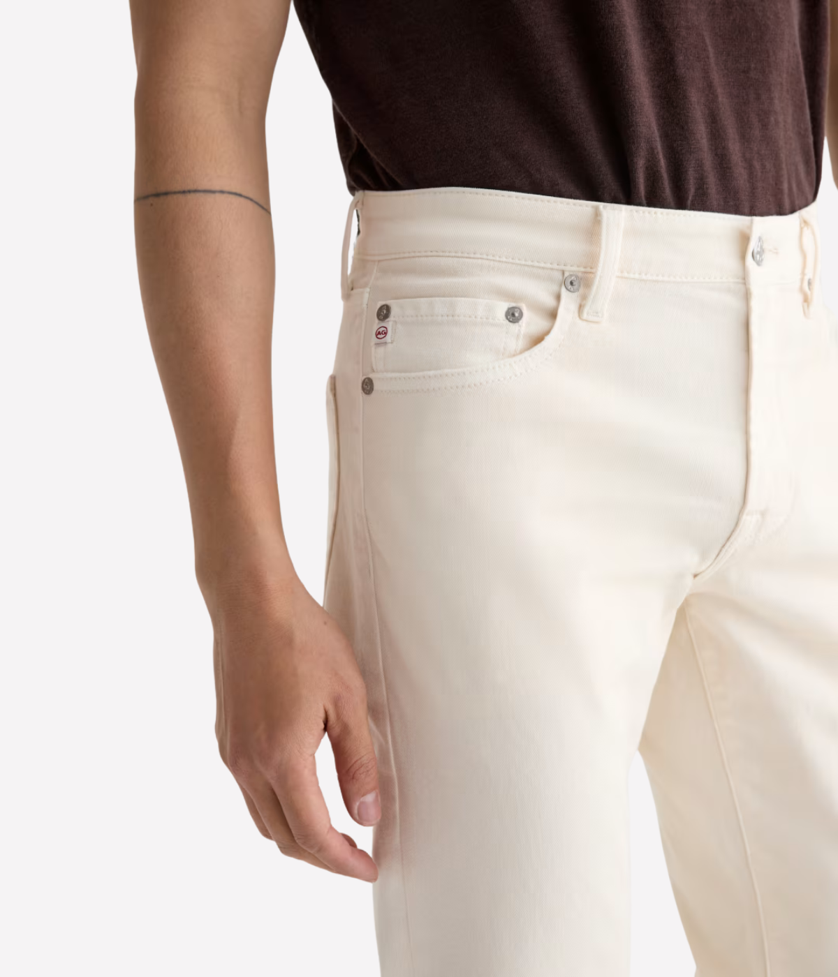 AG Tellis Jean in Sulfur Chalk worn on model - close up on waistband