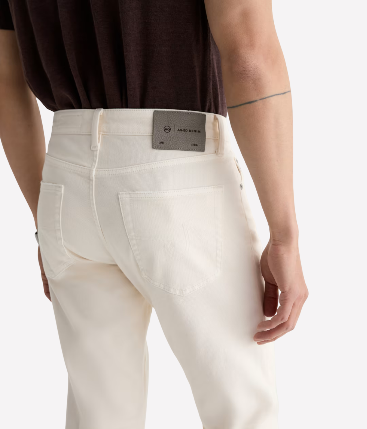 AG Tellis Jean in Sulfur Chalk worn on model - close up on back pocket details