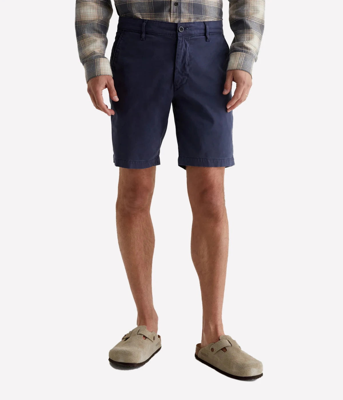 AG Wanderer Slim Fit Shorts in Sulfur Pacific Midnight (navy), featuring a sharp trouser look with a tapered leg opening. Made from ultra-lightweight cotton blend fabric for comfort. Material: 97.5% Cotton, 2.5% Elastane. Made in USA.