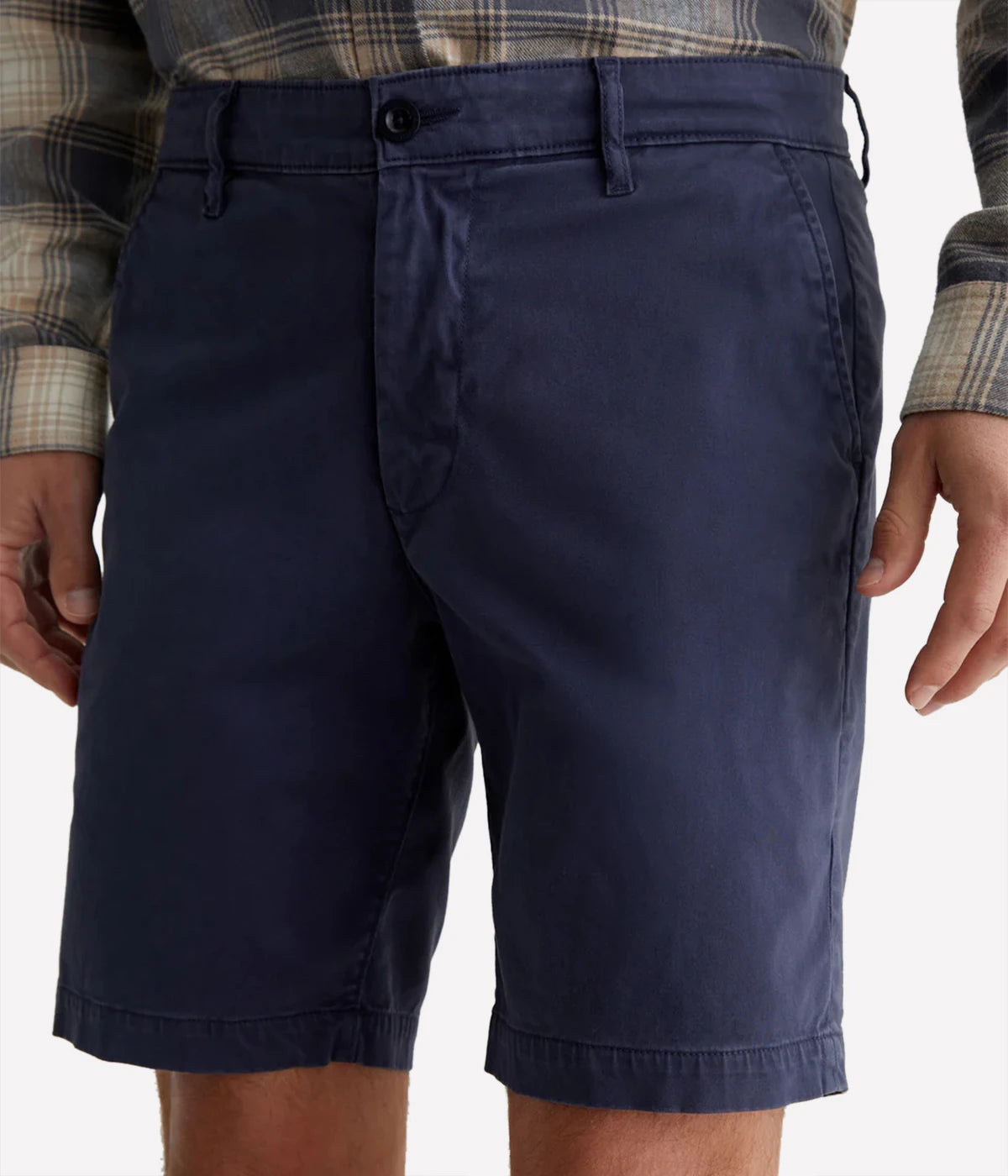 AG Wanderer Slim Fit Shorts in Sulfur Pacific Midnight (navy), featuring a sharp trouser look with a tapered leg opening. Made from ultra-lightweight cotton blend fabric for comfort. Material: 97.5% Cotton, 2.5% Elastane. Made in USA.