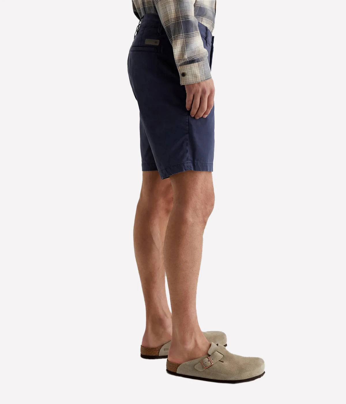 AG Wanderer Slim Fit Shorts in Sulfur Pacific Midnight (navy), featuring a sharp trouser look with a tapered leg opening. Made from ultra-lightweight cotton blend fabric for comfort. Material: 97.5% Cotton, 2.5% Elastane. Made in USA.