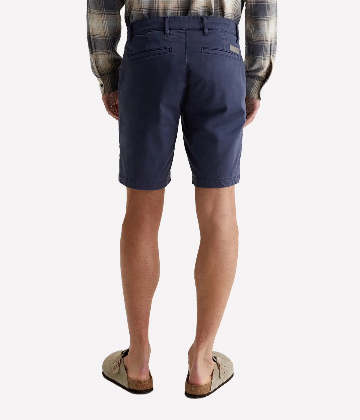 AG Wanderer Slim Fit Shorts in Sulfur Pacific Midnight (navy), featuring a sharp trouser look with a tapered leg opening. Made from ultra-lightweight cotton blend fabric for comfort. Material: 97.5% Cotton, 2.5% Elastane. Made in USA.