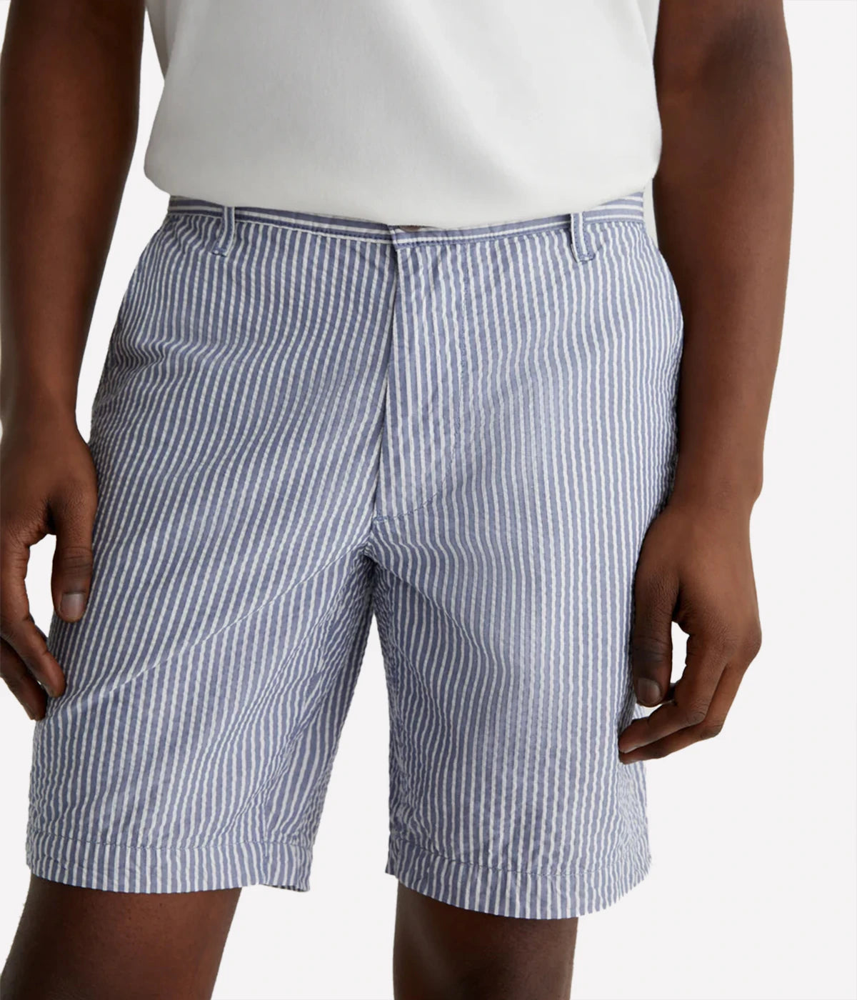 AG Wanderer Slim Fit Shorts in striped seersucker fabric, featuring a sharp trouser look with a tapered leg opening. Material: 100% Cotton. Made in USA.