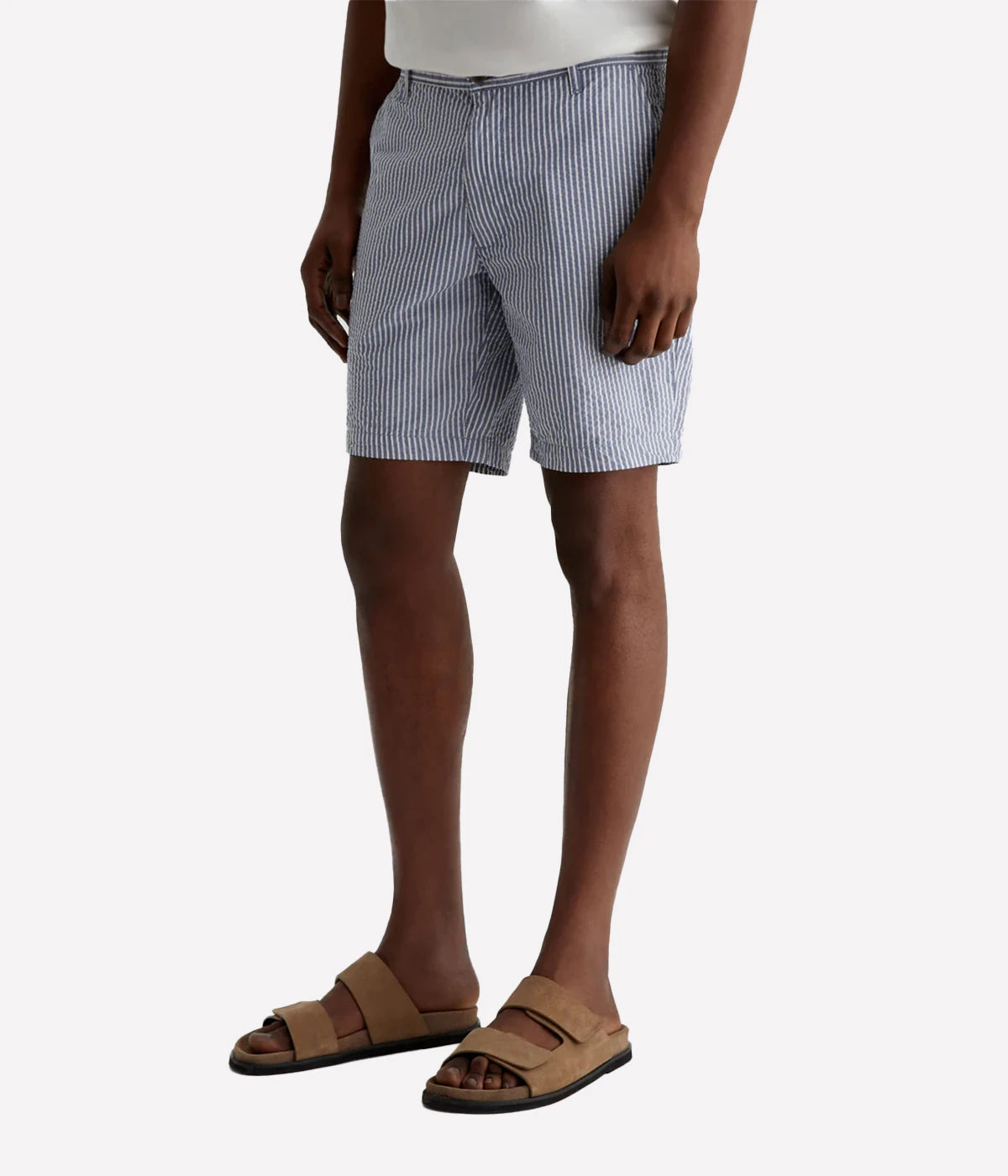 AG Wanderer Slim Fit Shorts in striped seersucker fabric, featuring a sharp trouser look with a tapered leg opening. Material: 100% Cotton. Made in USA.