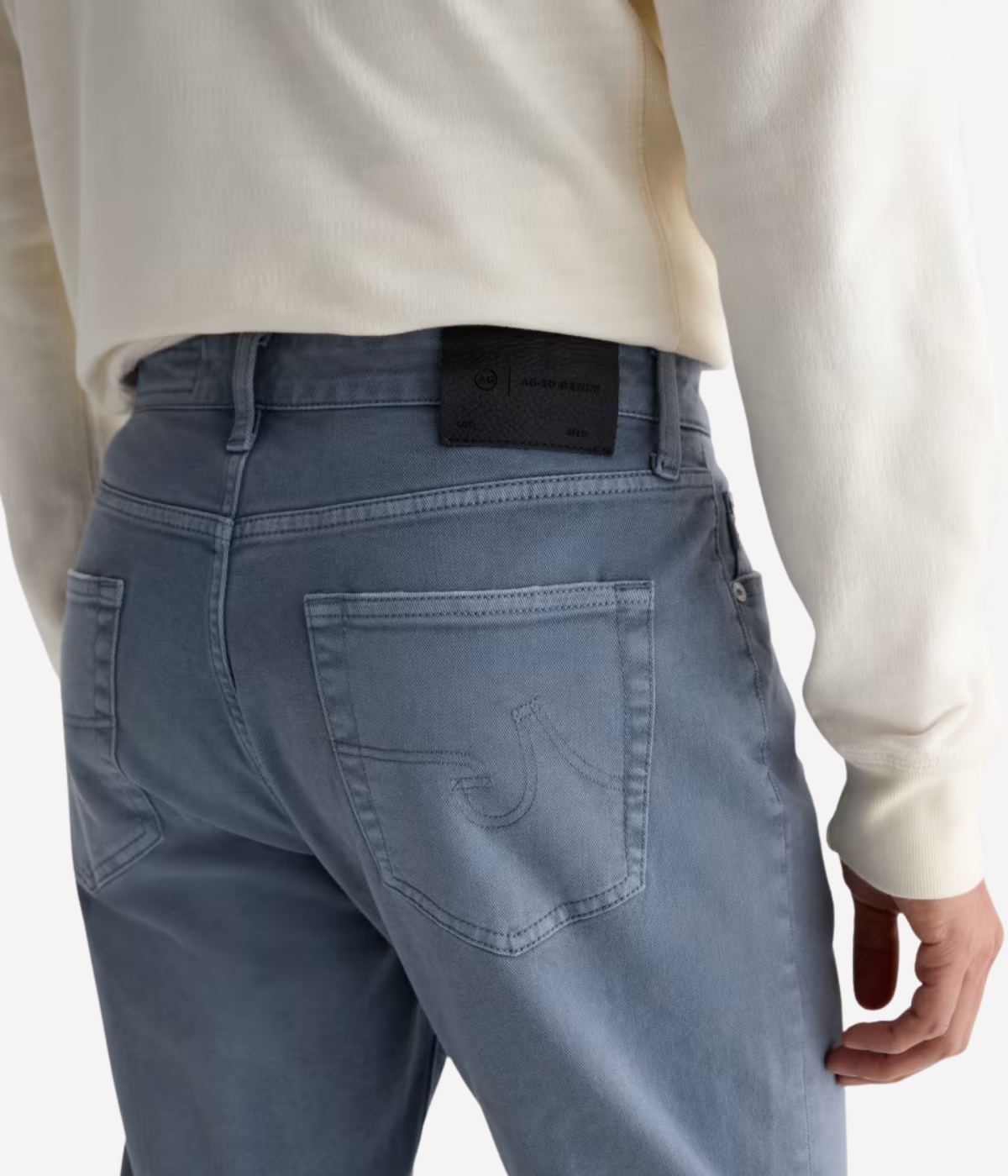 AG Everett Jean in 7 Years Sulfur Ashline worn on model - close up on back pocket details