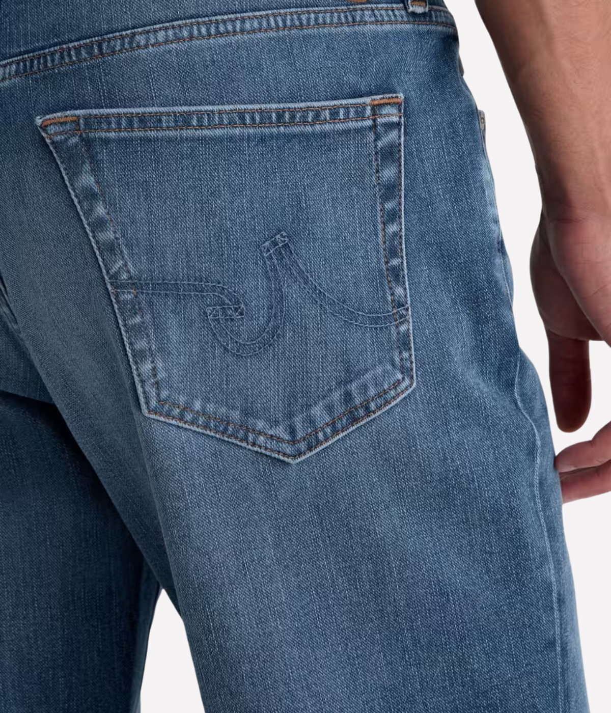 AG Reggie Jean in Northern Vine worn on model - close up on back pocket details