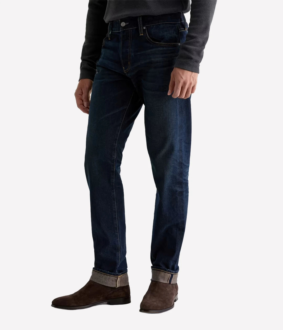 Man wearing AG Tellis Selvage Jean in 3 Years Out Of The Blue with a grey knit, three-quarter front view