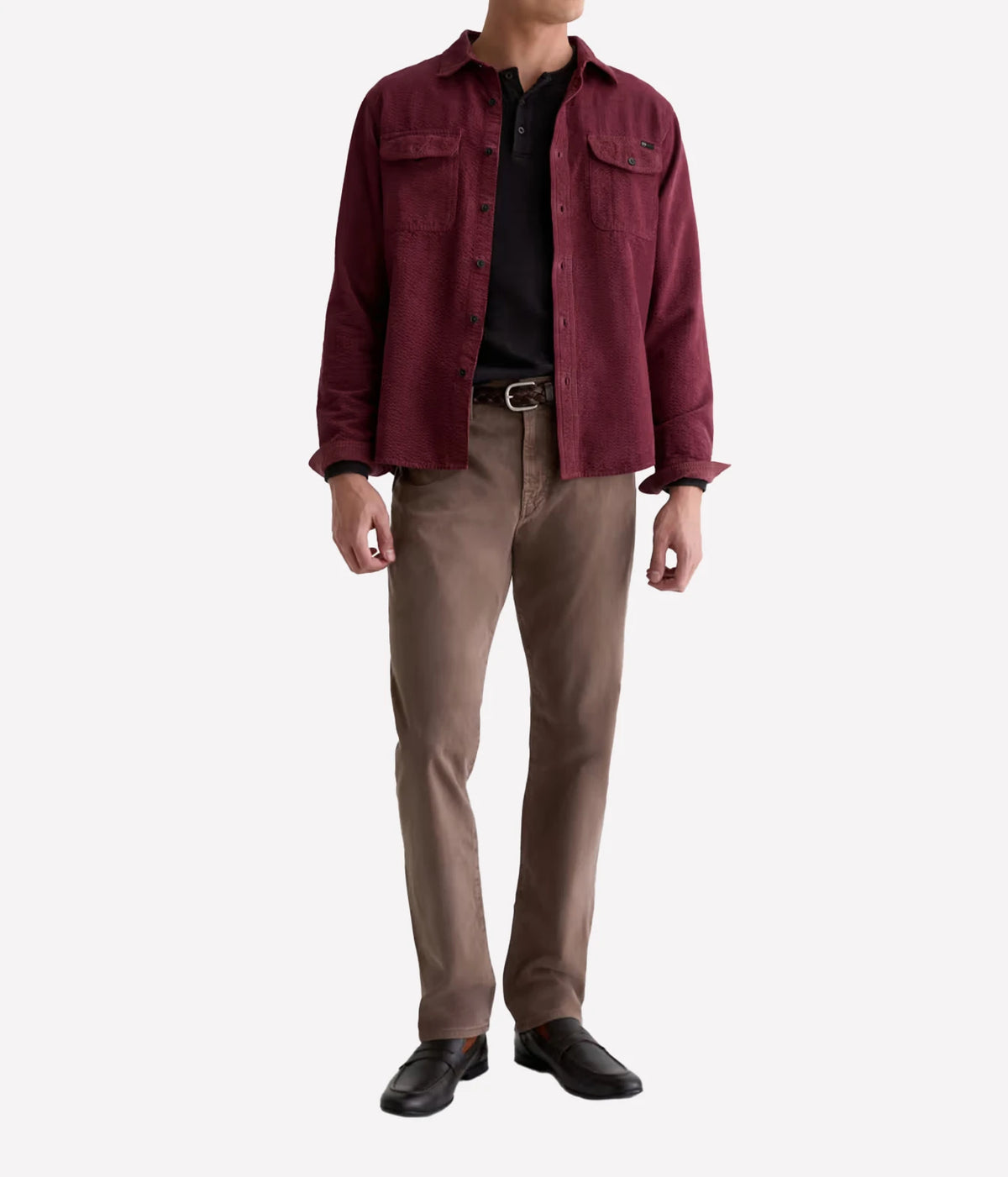 Man wearing AG Everett SUD Pant in Sulfur Taupe Grey with a burgundy jacket, black top and black shoes, front view