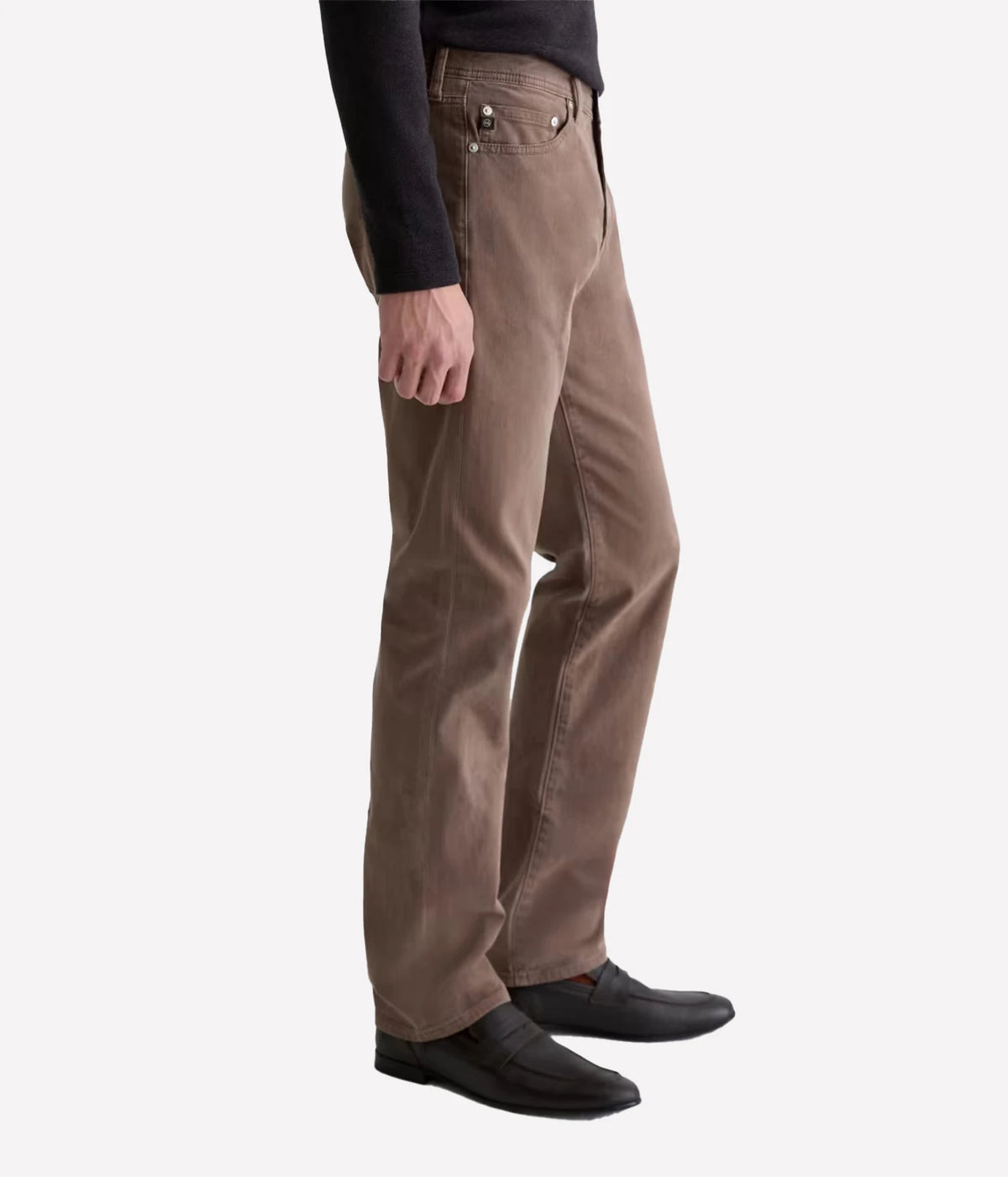 Man wearing AG Everett SUD Pant in Sulfur Taupe Grey with black shoes, side view
