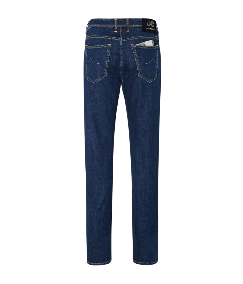 Jacob Cohën's Bard 5 Pocket Jeans from the exclusive Black Label Diamond Edition, crafted from dark blue super-stretch denim with a soft enzyme-washed finish. Features include subtle abrasions, logo embroidery on the coin pocket, a removable black calf hair patch with a gold-tone logo and diamond dust JC motif, and a light gold-tone button with cobalt-blue enamelled edges and diamond dust.