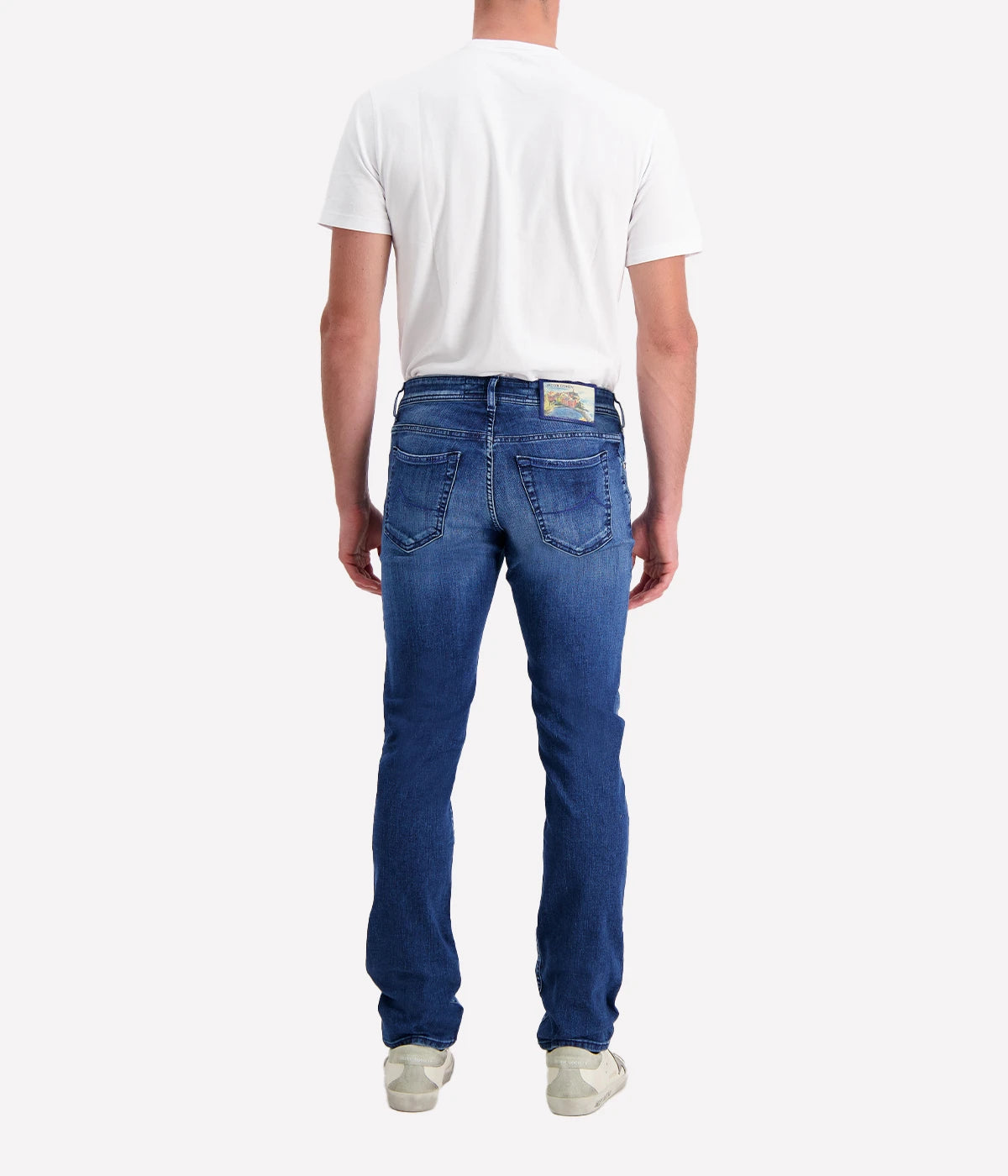 Jacob Cohen's Bard 5-Pocket Jean in a mid-blue wash. Showcasing a mid-rise, slim fit with branded hardware and suede patch detail. A versatile, luxurious jean for both casual and formal occasions.
