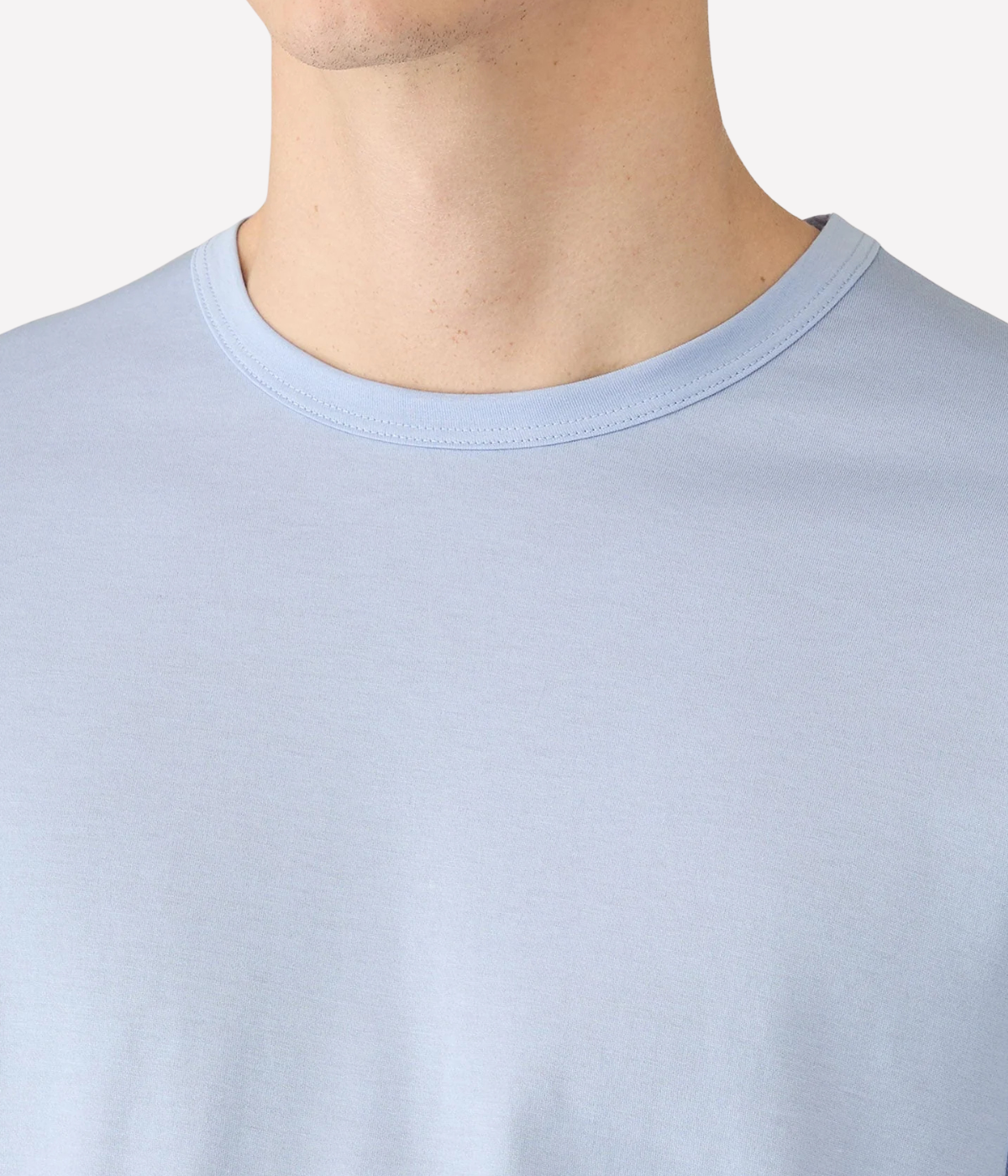 Sunspel Short Sleeve Crew Neck T-Shirt in Sky close-up on model showing crew neckline and Supima cotton texture