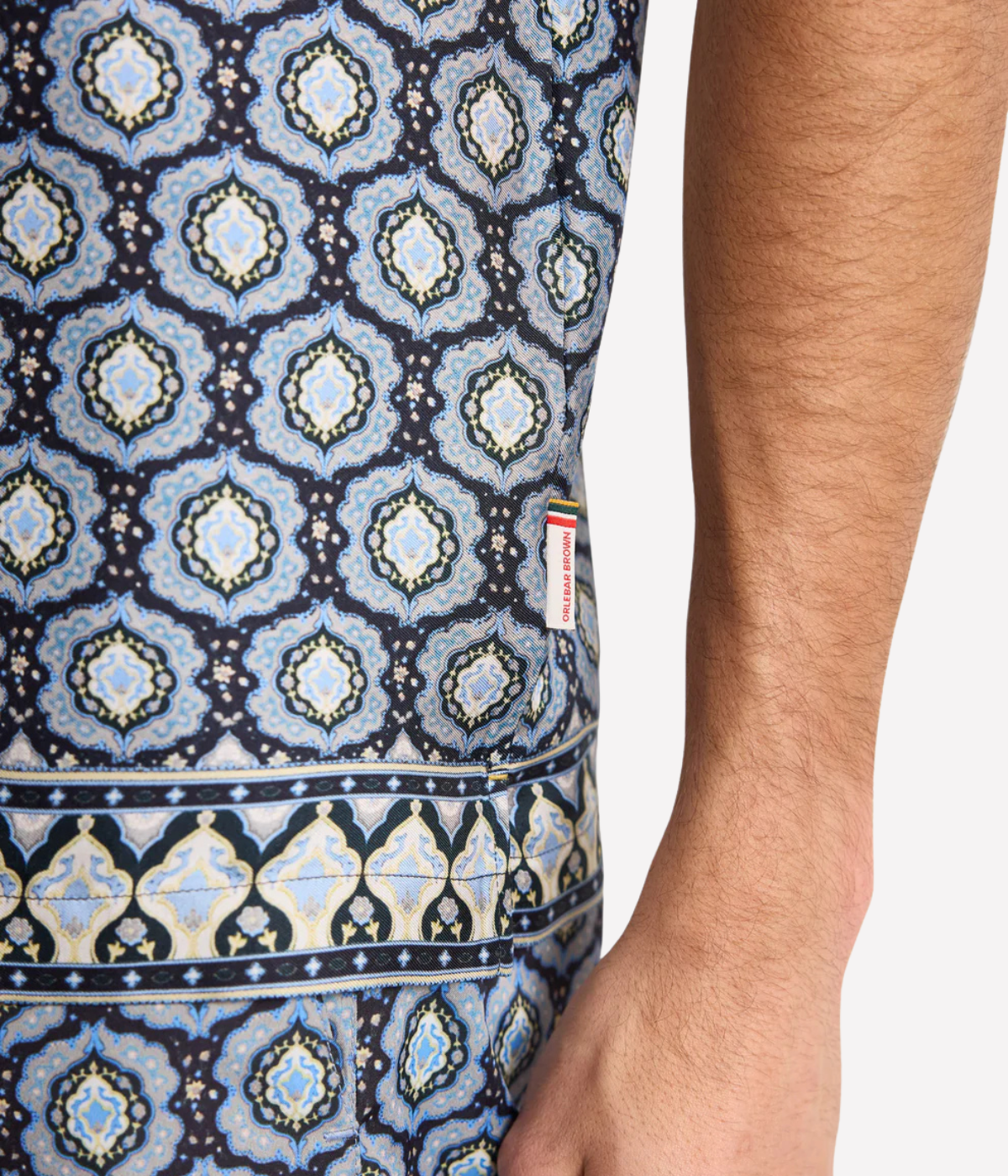 Orlebar Brown Maitan Silk Passetto Shirt in Night Iris featuring an exclusive print, Capri collar and relaxed fit - Closeup Shot on Logo Labelling