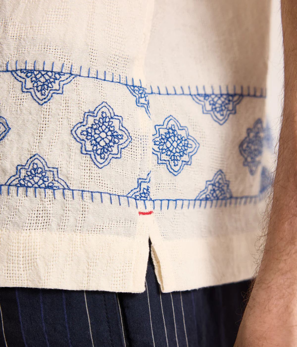 Orlebar Brown Maitan Carnival Embroidery Shirt in White Sand & Nightfall Blue featuring exclusive embroidered artwork, a Capri collar and relaxed fit - Closeup Shot on Embroidery