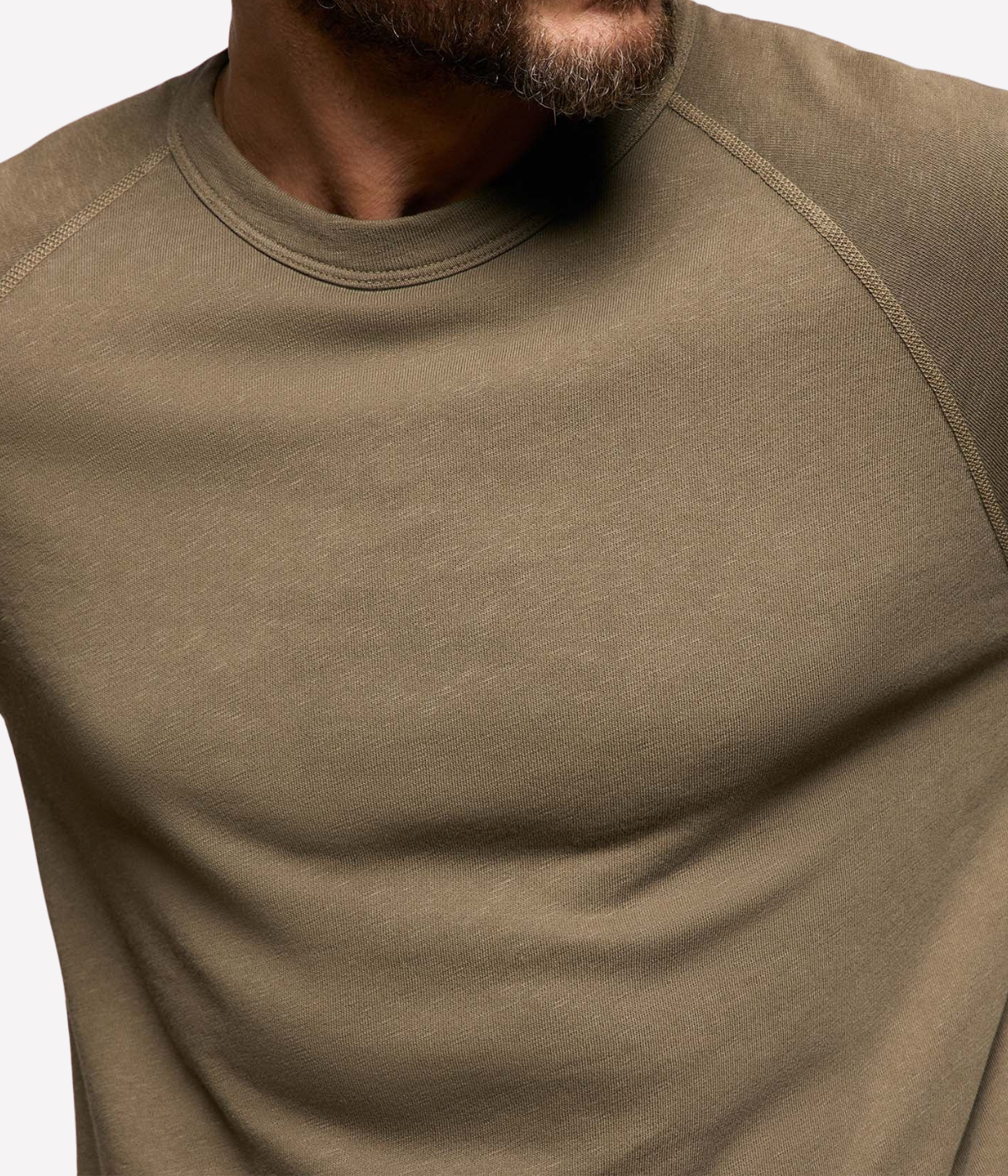 James Perse Vintage French Terry Sweatshirt in Light Olive Pigment – close-up of crew neckline showcasing clean construction and soft garment-dyed cotton.