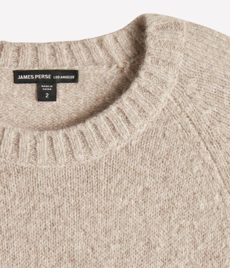 A soft, lightweight cashmere crewneck sweater in hazel brown, featuring ribbed detailing at the neckline, cuffs, and hem for a timeless and polished design.