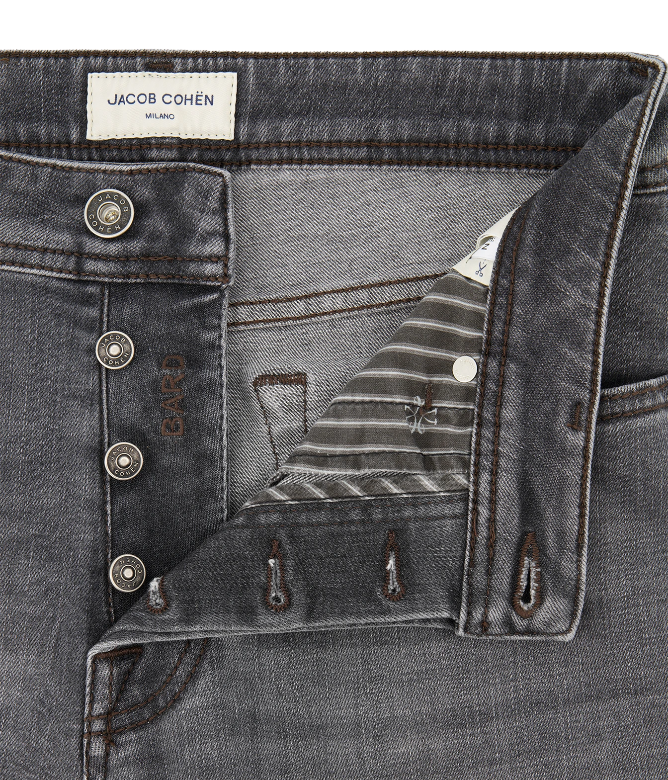 Close-up of a gray denim jacket or overshirt by Jacob Cohen, showing the buttoned front, inner pocket flap, striped lining, and metal snap details against a white background.