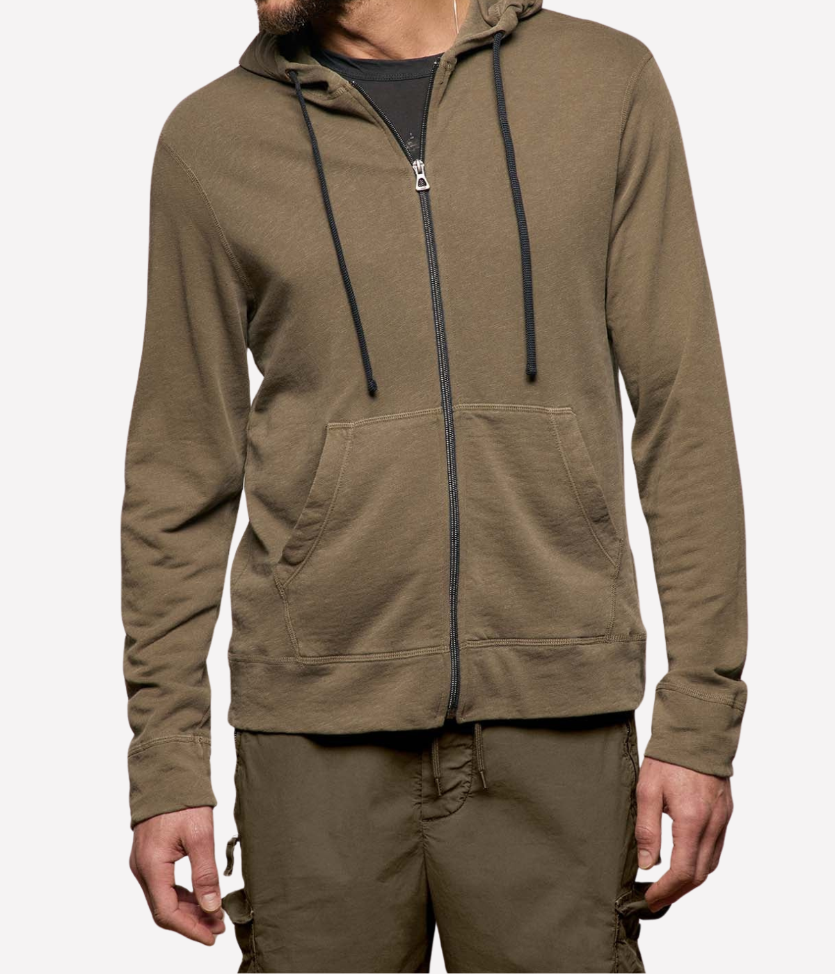 James Perse Vintage French Terry Zip Hoodie in Light Olive Pigment – upper body view on model highlighting zip-front closure, drawcord hood, and patch pocket detailing.