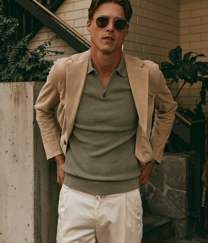 Eleventy sage green textured cotton polo shirt with short sleeves, half zip front, and ribbed trims, made in Italy.