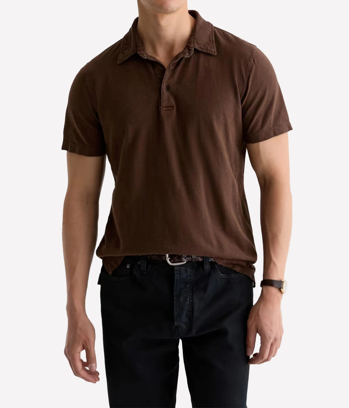 Man wearing AG Bryce Short Sleeve Polo in Sulfur Wood Brown with dark jeans, front view