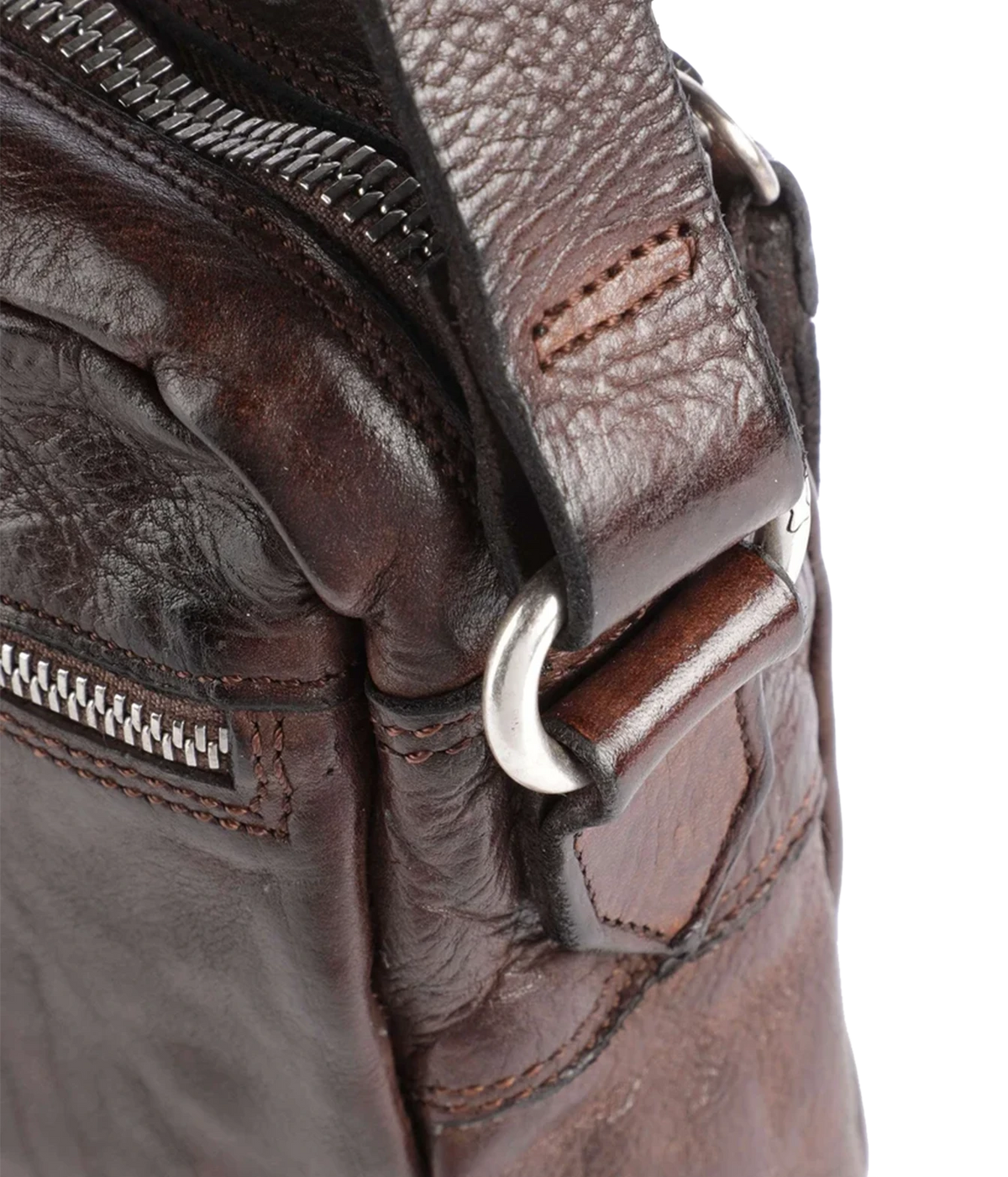 Close-up of Campomaggi Fico Small Crossbody Bag in Brown showing the zip pull and silver-tone fittings