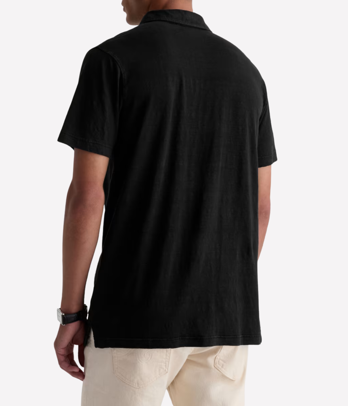 AG Bryce Short Sleeve Polo in True Black worn on model back view.