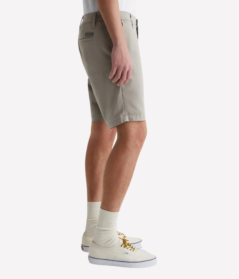 Side view of AG Wanderer Shorts in Dry Dust, highlighting the slightly tapered legs and refined performance fabric.