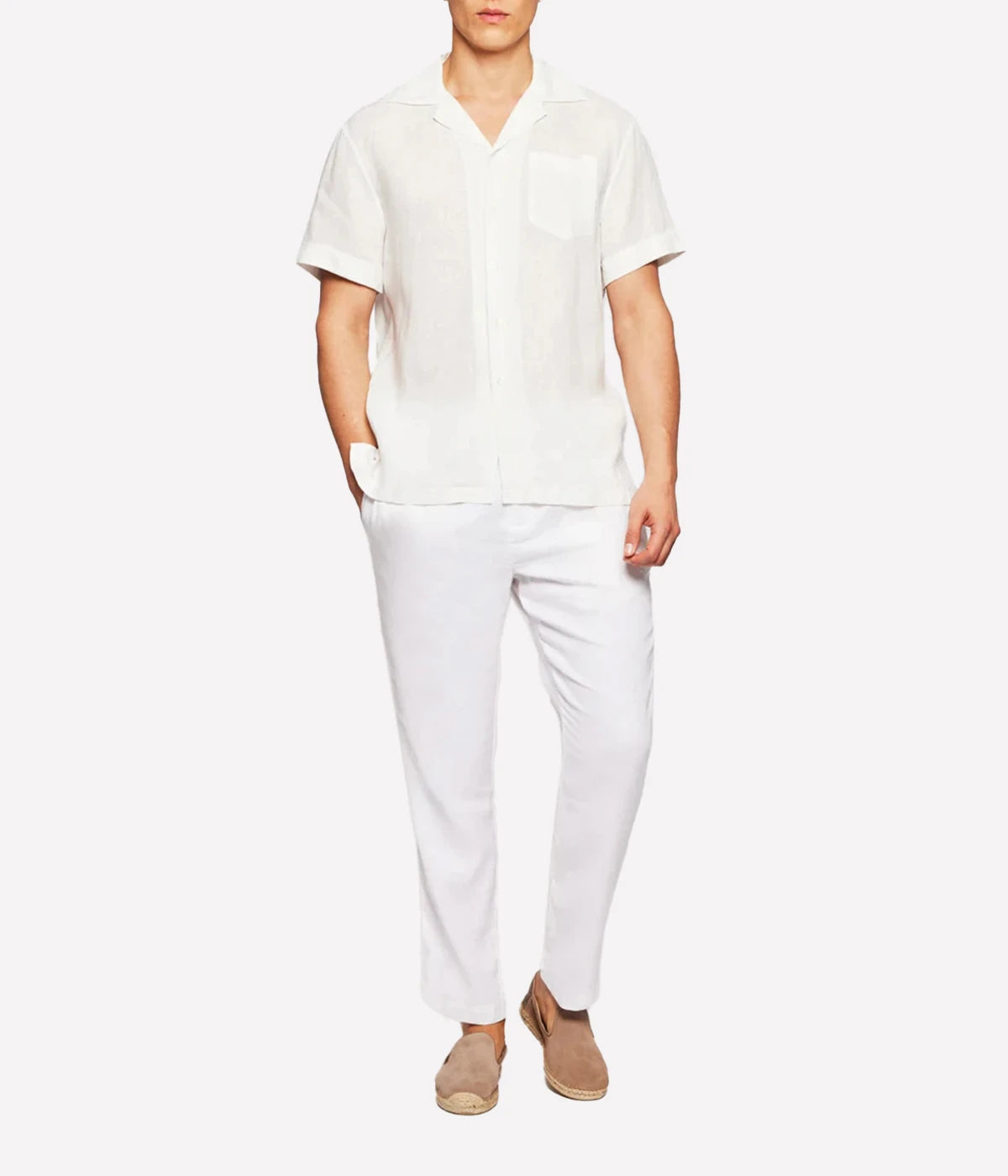 A relaxed-fit Angelo Shirt by Frescobol Carioca in lightweight Italian linen. Features a camp collar, chest pocket, and breathable fabric for effortless warm-weather style. Made in Portugal.