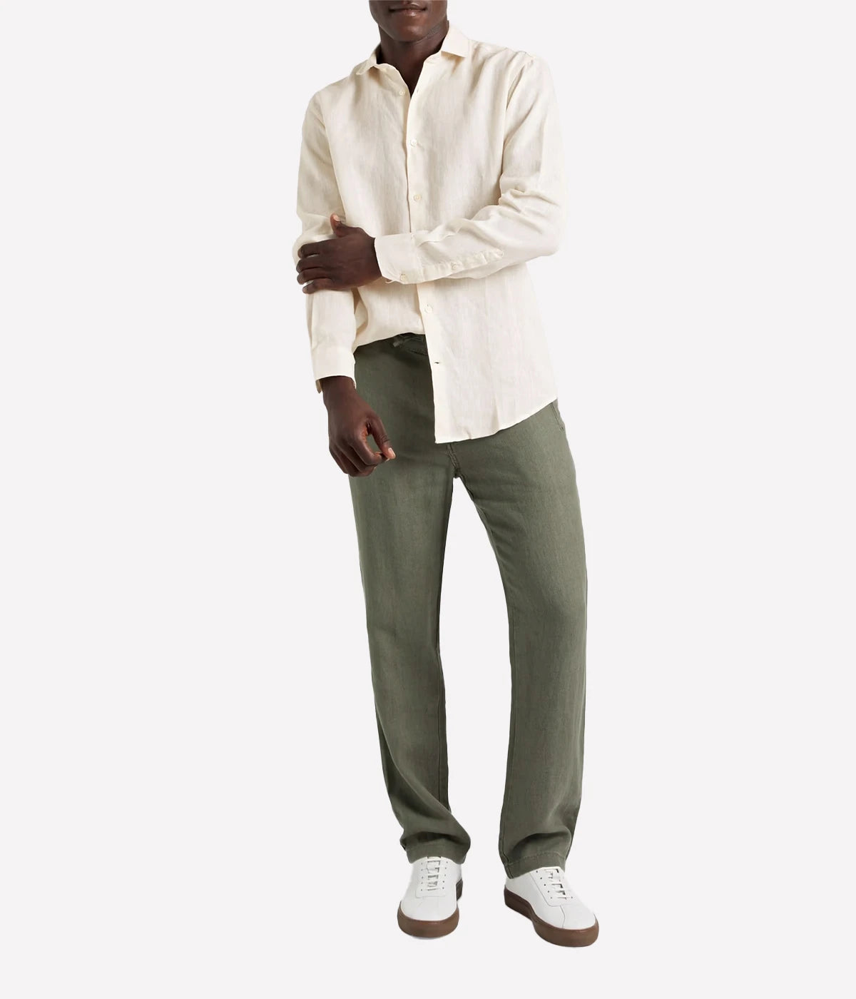 Model wearing the Antonio Long Sleeve Linen Shirt by Frescobol Carioca, showcasing the refined tailoring and premium 100% Italian linen fabric. The structured dress collar, long sleeves, and imitation mother of pearl buttons make this shirt a sophisticated choice for formal or relaxed occasions.