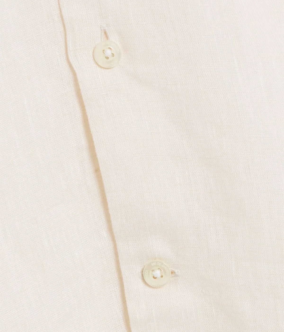 Close-up of the Antonio Long Sleeve Linen Shirt by Frescobol Carioca, crafted from premium fine Italian linen. The smooth texture and lightweight feel of the fabric ensure comfort and elegance, enhanced by imitation mother of pearl buttons for a sophisticated finish.