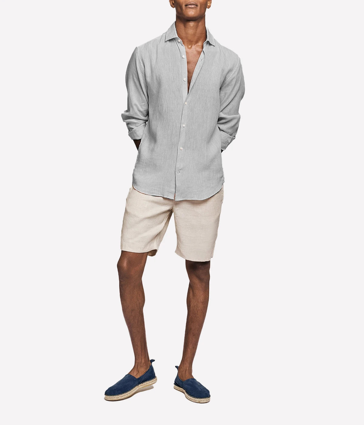 Model wearing the Antonio Long Sleeve Linen Shirt by Frescobol Carioca, showcasing the refined tailoring and premium 100% Italian linen fabric. The structured dress collar, long sleeves, and imitation mother of pearl buttons make this shirt a sophisticated choice for formal or relaxed occasions.