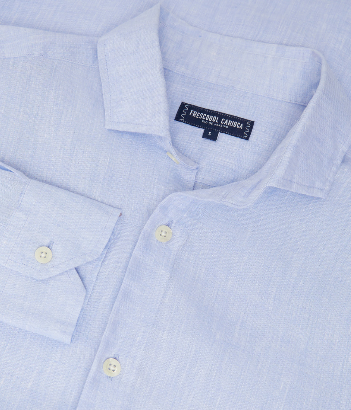 the Antonio Long Sleeve Linen Shirt by Frescobol Carioca, floating to emphasize its structured dress collar with stiffeners, imitation mother of pearl buttons, and full placket. The lightweight Italian linen construction ensures breathable comfort and elevated style for versatile occasion dressing.