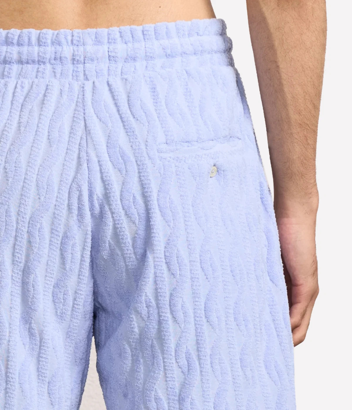 Light blue Augusto shorts by Frescobol, crafted from 100% cotton with a relaxed fit. Features an elasticated adjustable waist, zip-fly, branded metal-cord ends, side slip pockets, and a back pocket with button closure.