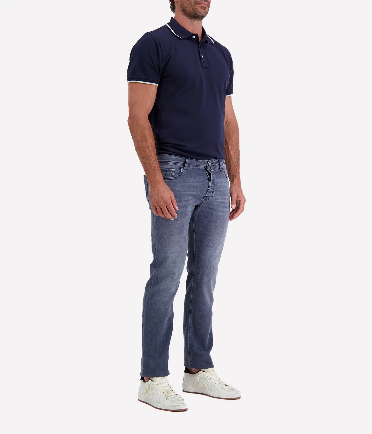 Jacob Cohen Bard 5 Pocket Slim Jeans in a washed blue finish, featuring a modern slim fit, classic five-pocket styling, and contrast stitching. Styled with a navy tee and white sneakers for a casual yet polished look.
