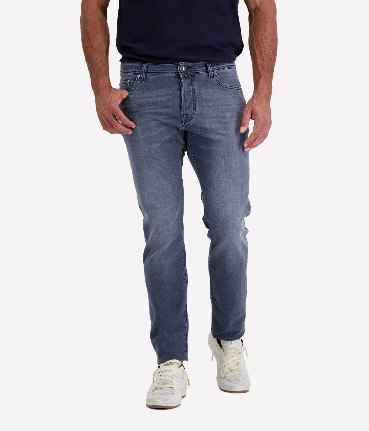 Jacob Cohen Bard 5 Pocket Slim Jeans in a washed blue finish, featuring a modern slim fit, classic five-pocket styling, and contrast stitching. Styled with a navy tee and white sneakers for a casual yet polished look.