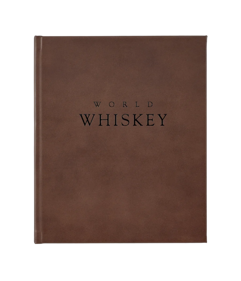 Luxury whiskey guide, hand-bound in bonded leather, featuring 352 pages on 700+ whiskey varieties, award-winners, and global distilleries.