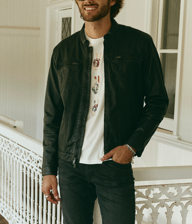 John Varvatos sheepskin leather jacket with a denim silhouette, featuring zipped chest pockets, dual zip front closure, and a fully lined interior.