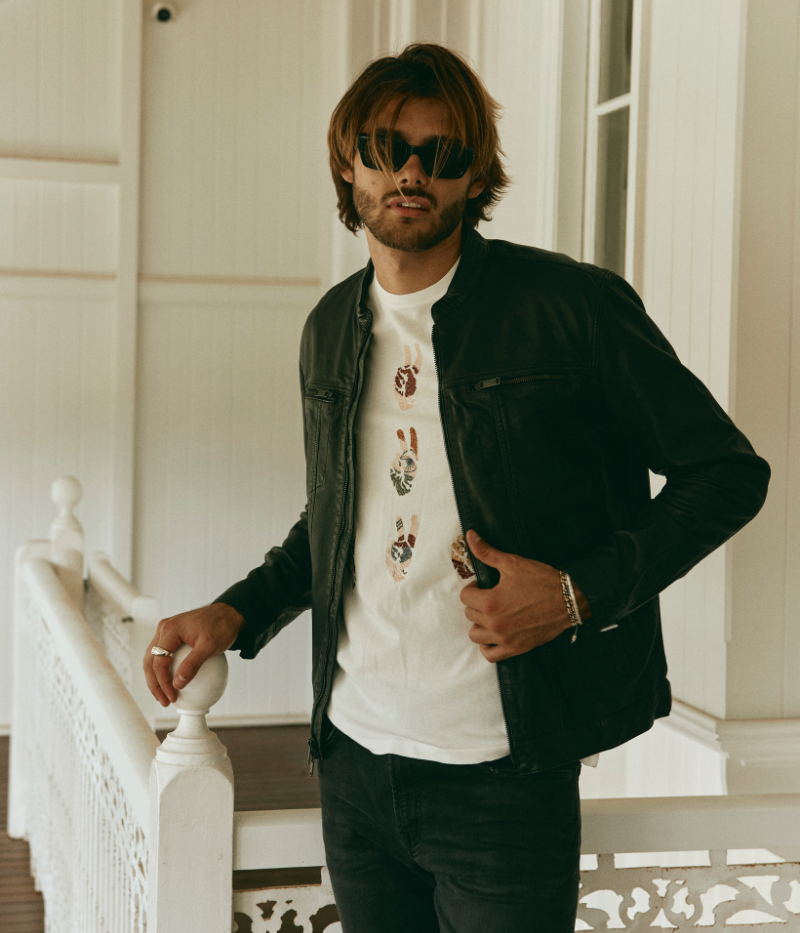 John Varvatos sheepskin leather jacket with a denim silhouette, featuring zipped chest pockets, dual zip front closure, and a fully lined interior.