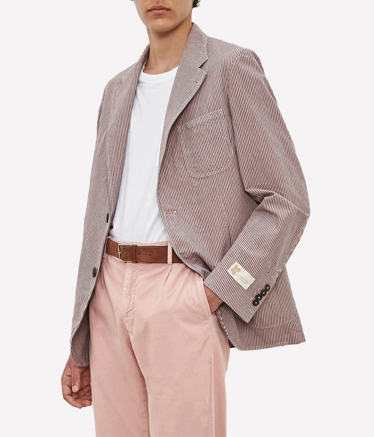 Deconstructed cotton-linen jacket with a two-button front, patch pockets, and dark horn buttons.