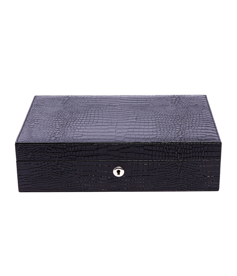 The Brompton Watch Box is meticulously handcrafted from solid wood and wrapped in luxurious black crocodile-pattern leather. Designed to hold up to ten watches, it features a plush suede-lined interior and adjustable cushions to securely fit timepieces of all sizes. A sophisticated storage solution for protecting and displaying your watch collection.