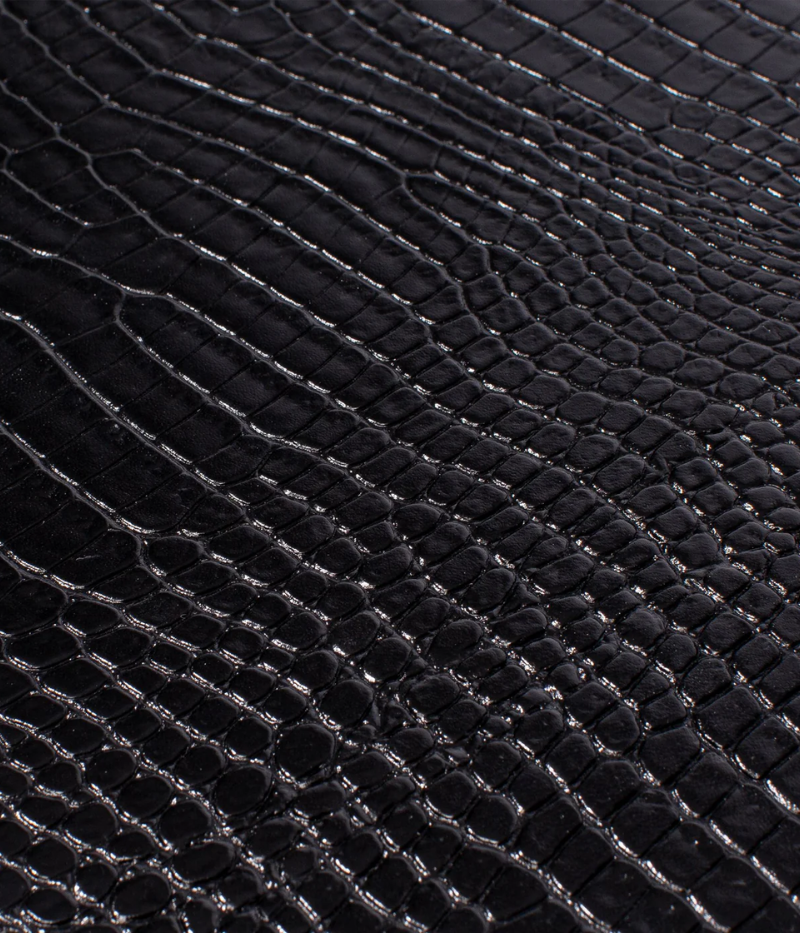 The Brompton Watch Box is meticulously handcrafted from solid wood and wrapped in luxurious black crocodile-pattern leather. Designed to hold up to ten watches, it features a plush suede-lined interior and adjustable cushions to securely fit timepieces of all sizes. A sophisticated storage solution for protecting and displaying your watch collection.