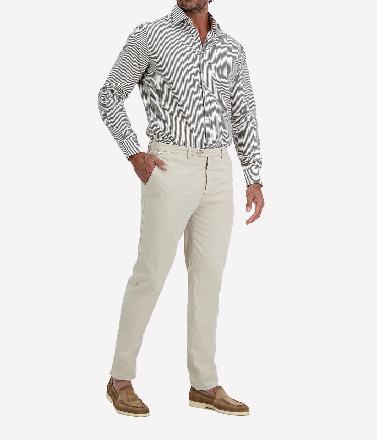 Man wearing Ingram Slim Fit Shirt in Sage & White Stripe with stone chinos and brown suede shoes, three-quarter view