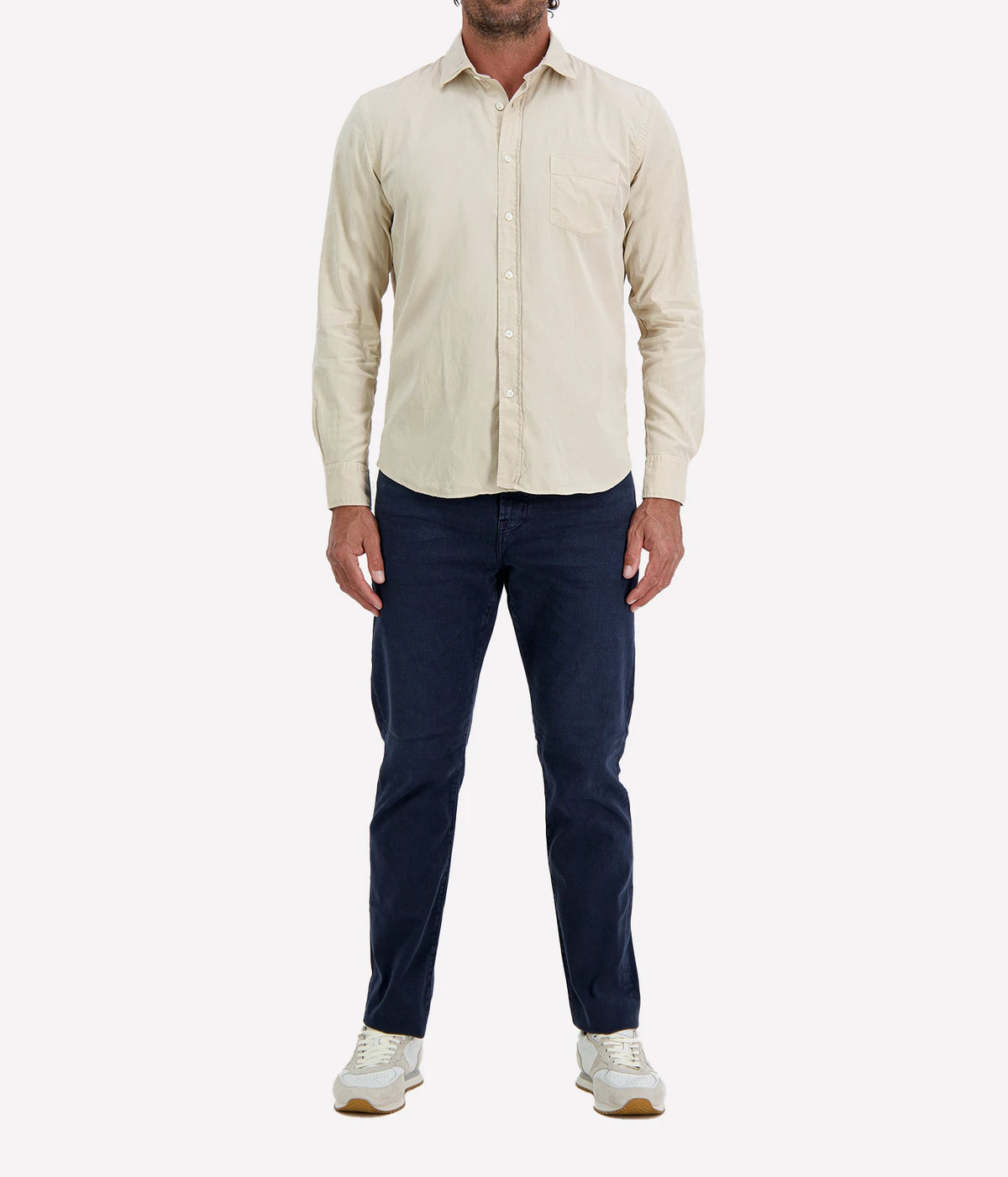 Man wearing Hartford Paul Tencel & Cotton Shirt in Stone with indigo jeans and white sneakers, full-length front view