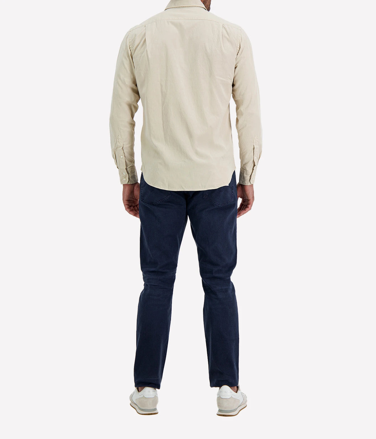 Back view of man wearing Hartford Paul Tencel & Cotton Shirt in Stone with indigo jeans and white sneakers