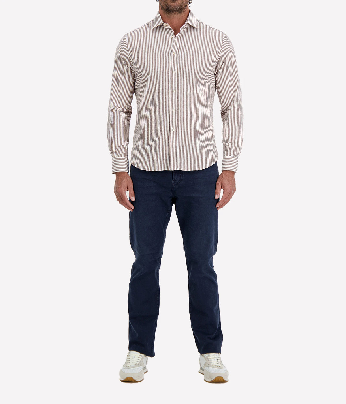 Man wearing Ingram Slim Fit Shirt in Seersucker Brown & White Stripe with indigo jeans and white sneakers, full-length front view