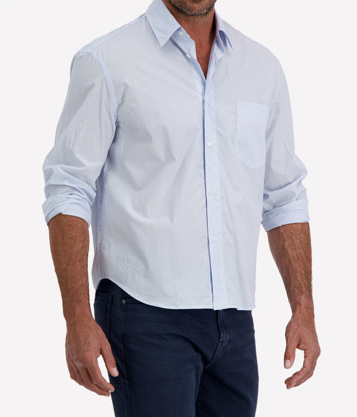 Man wearing Lardini Cotton Pocket Shirt in Blue Stripe with indigo jeans, cropped angled front view