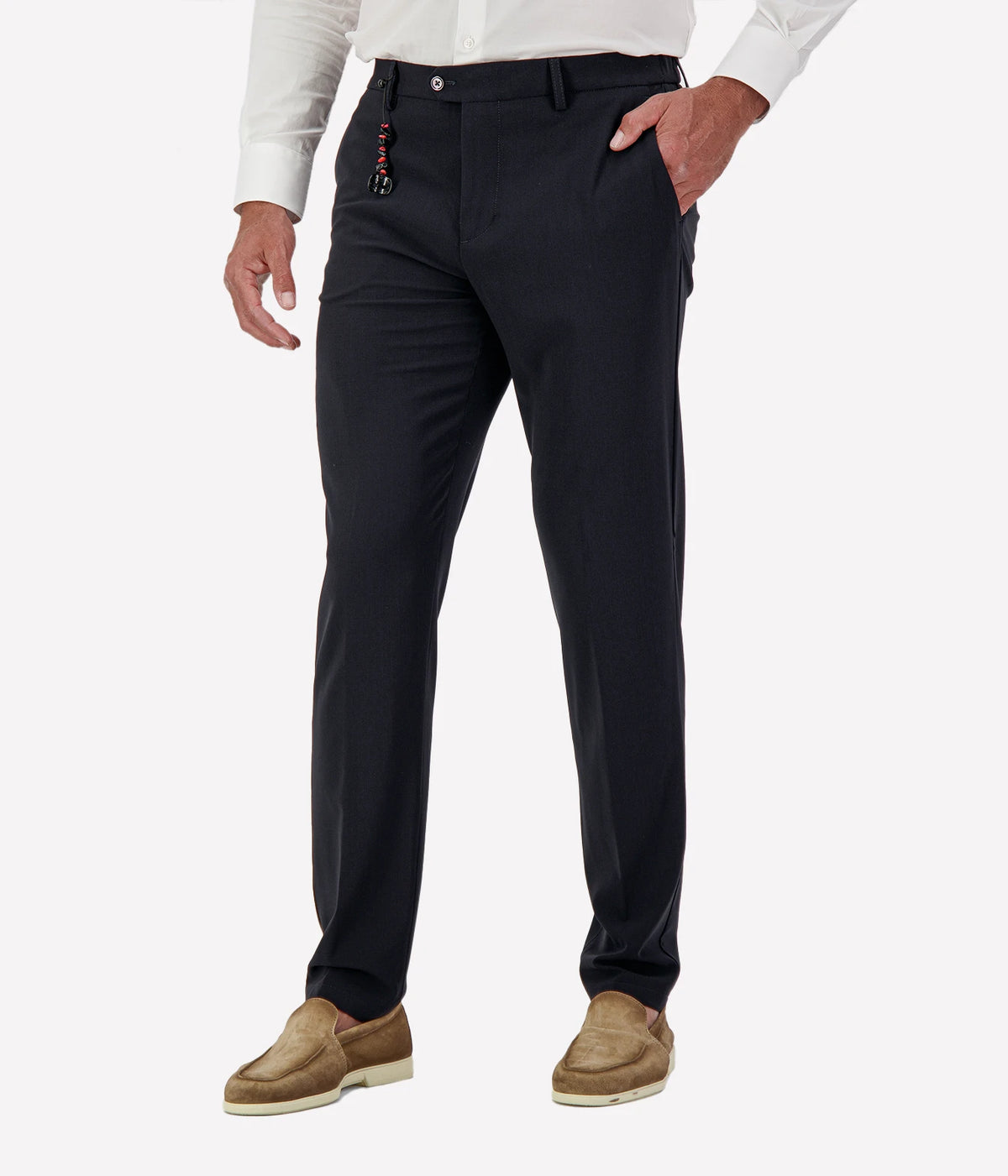 Man wearing Marco Pescarolo Evo Wool Trouser in Navy with a white shirt and tan suede shoes, cropped front view with hand in pocket