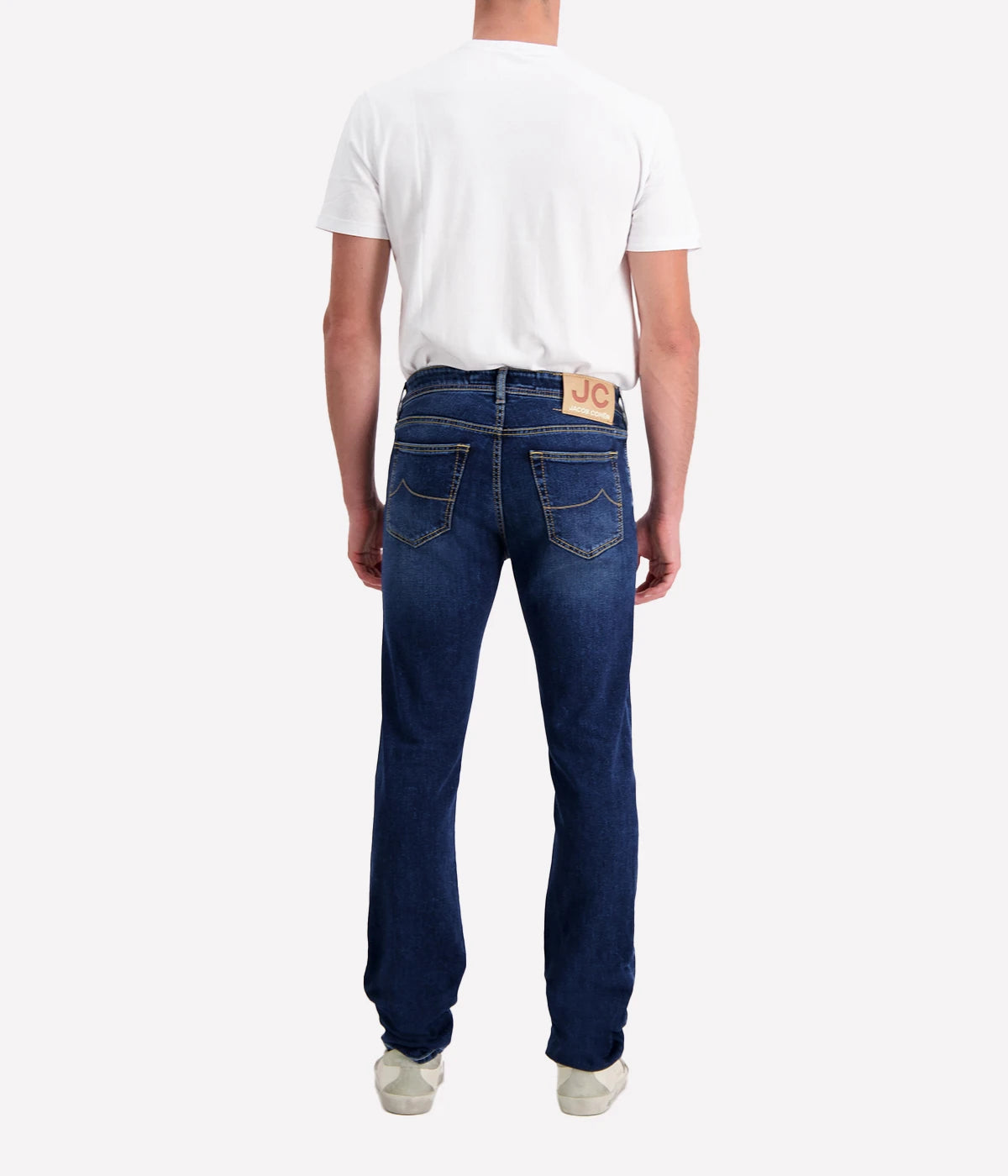 Bard 5-Pocket Jean by Jacob Cohen in a blue wash. Designed with a mid-rise, slim fit, and crafted from premium stretch denim, featuring signature branded hardware and a suede patch detail. A versatile, stylish jean suitable for both casual and formal looks.