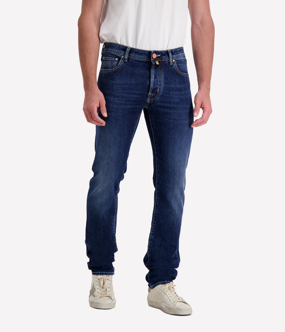 Bard 5-Pocket Jean by Jacob Cohen in a blue wash. Designed with a mid-rise, slim fit, and crafted from premium stretch denim, featuring signature branded hardware and a suede patch detail. A versatile, stylish jean suitable for both casual and formal looks.